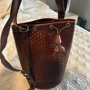 Genuine brown leather bucket bag. Can be a bag or backpack.